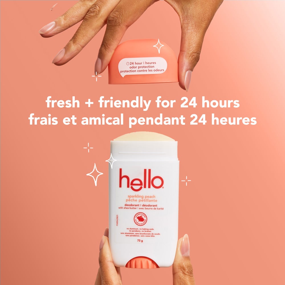 A white bottle of Hello Sparkling Peach deodorant. The bottle has blue and green lettering and states "24 hour odor protection," "sparkling peach," "with shea butter," "no aluminum," "no baking soda," "no parabens," and "no brainer" in both English and French.
