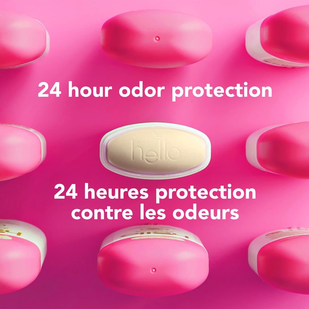 A top-down view of several pink deodorant containers arranged around a central yellow-green oval container embossed with the word "hello." The image includes the text "aluminum free.