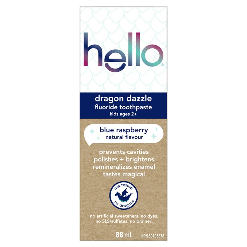 A carton of Hello Dragon Dazzle fluoride toothpaste for kids ages 2+. The carton features a dragon illustration and text that reads "blue raspberry," "natural flavour," "prevents cavities polishes + brightens remineralizes enamel," "tastes magical," and "not tested on dragons." It also lists the features "no artificial sweeteners. no dyes. no SLS/sulfates. no brainer" and indicates the size is 88 mL.