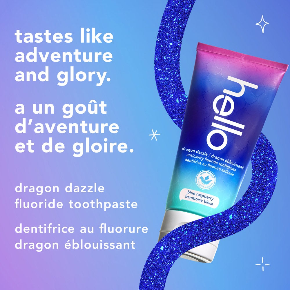 A tube of hello dragon dazzle blue raspberry fluoride toothpaste is displayed on a sparkly blue curved border with a light blue background. The text reads, "tastes like adventure and glory. dragon dazzle fluoride toothpaste."